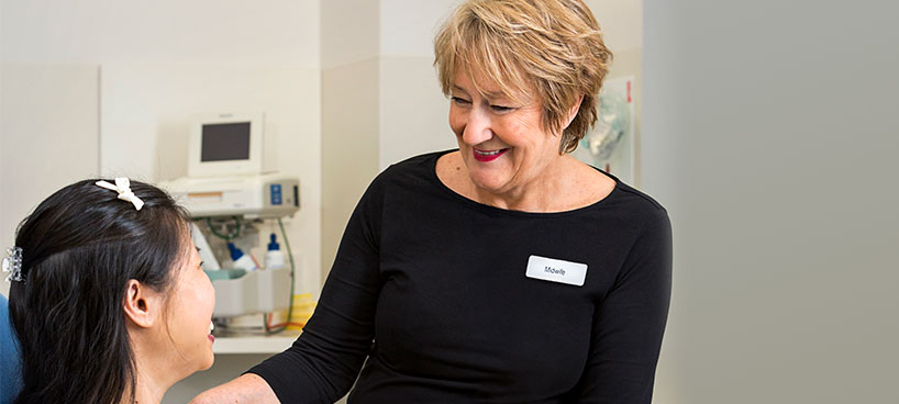 Midwife assisting patient