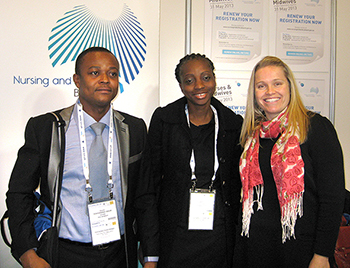 Photo of Board exhibition booth with David Tenkorang-Twum, Helen Lorna Ngul and Kristy Mutsaers